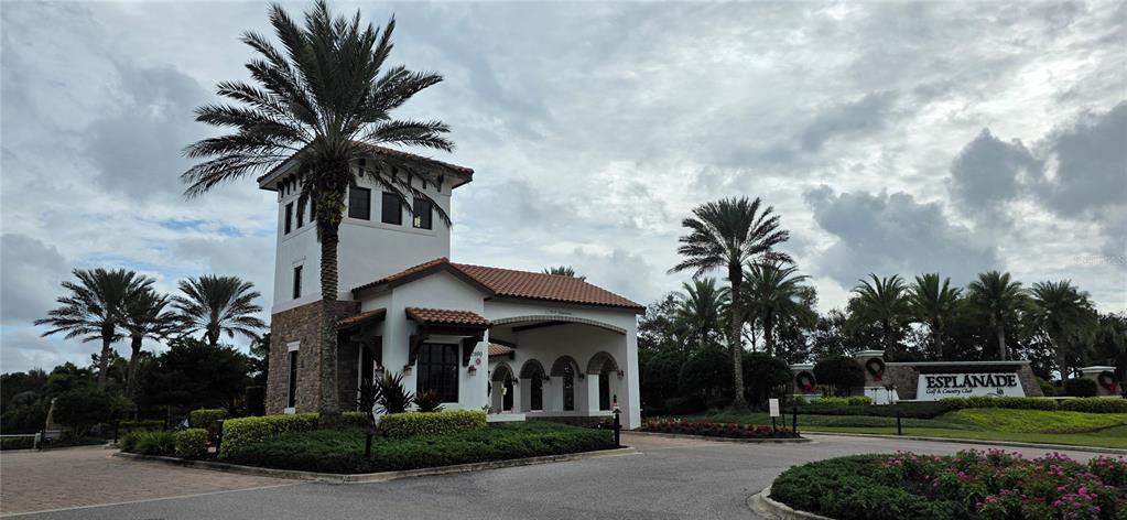 13608 Messina Loop, Unit 202 Bradenton, FL 34211 - Photo 72 of 73 a front view of a house with a yard and garage