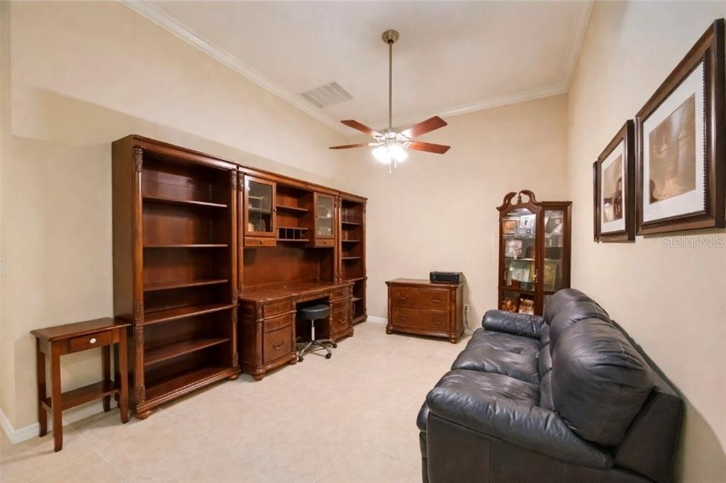 13608 Messina Loop, Unit 202 Bradenton, FL 34211 - Photo 8 of 73 a living room with furniture a ceiling fan and a window