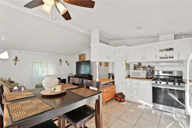 a kitchen with stainless steel appliances kitchen island granite countertop a sink and cabinets