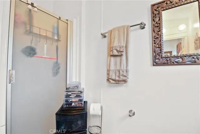 a bathroom with a mirror and a shower