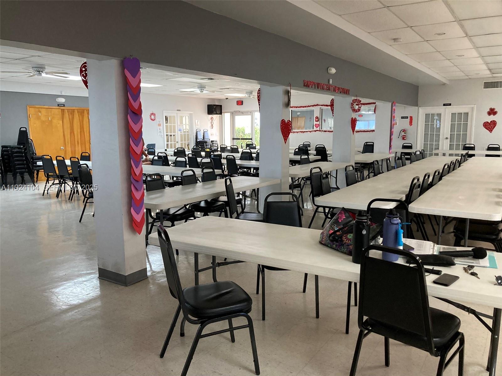 5300 Washington Street, Unit N117 Hollywood, FL 33021 - Photo 83 of 99 a view of a dining room with furniture and chandelier