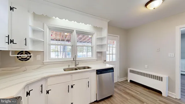 a kitchen with a sink and a window