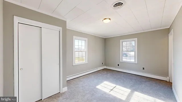 a view of empty room with windows