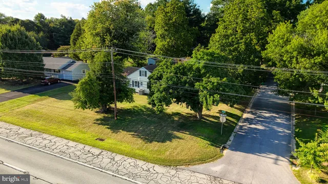 a view of a house with a yard and garden