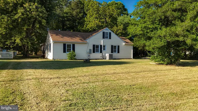 an aerial view of a house with pool