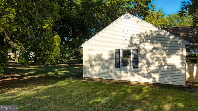 a view of a house with a yard and plants