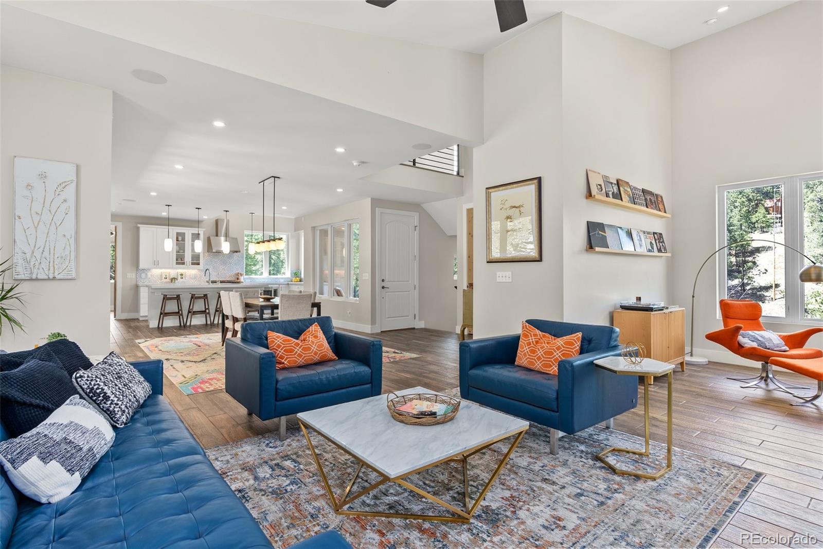9218 South Turkey Creek Road Morrison, CO 80465 - Photo 13 of 44 a living room with furniture and wooden floor