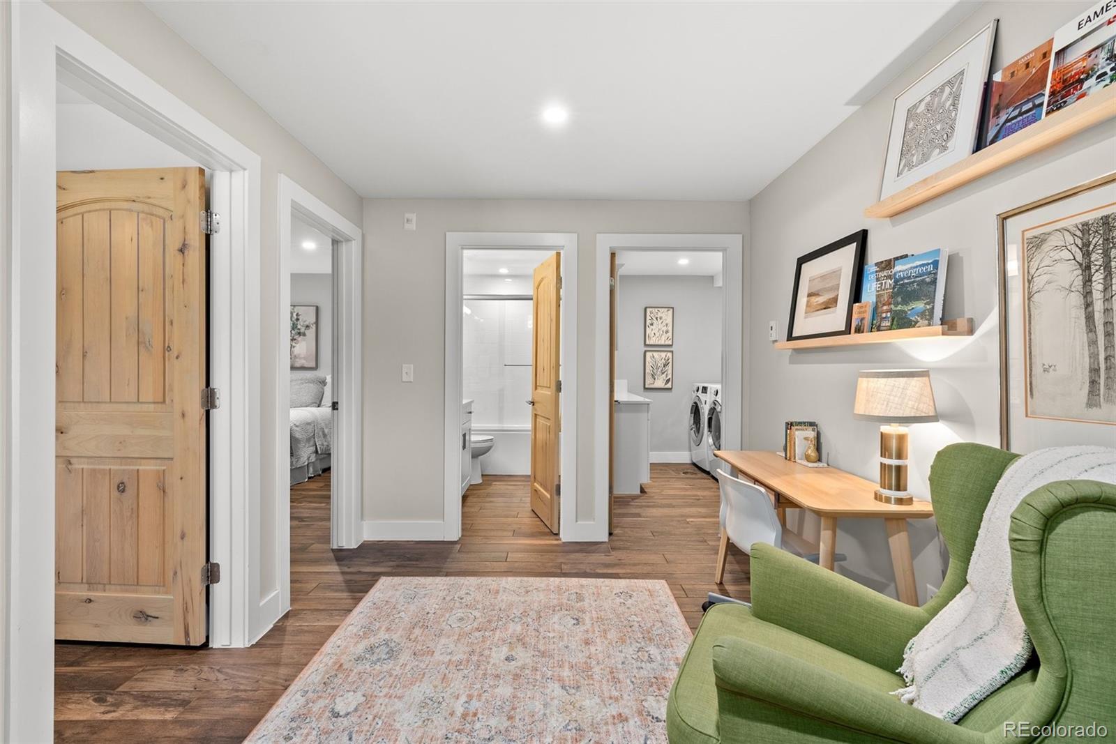 9218 South Turkey Creek Road Morrison, CO 80465 - Photo 25 of 44 a living room with furniture and a rug
