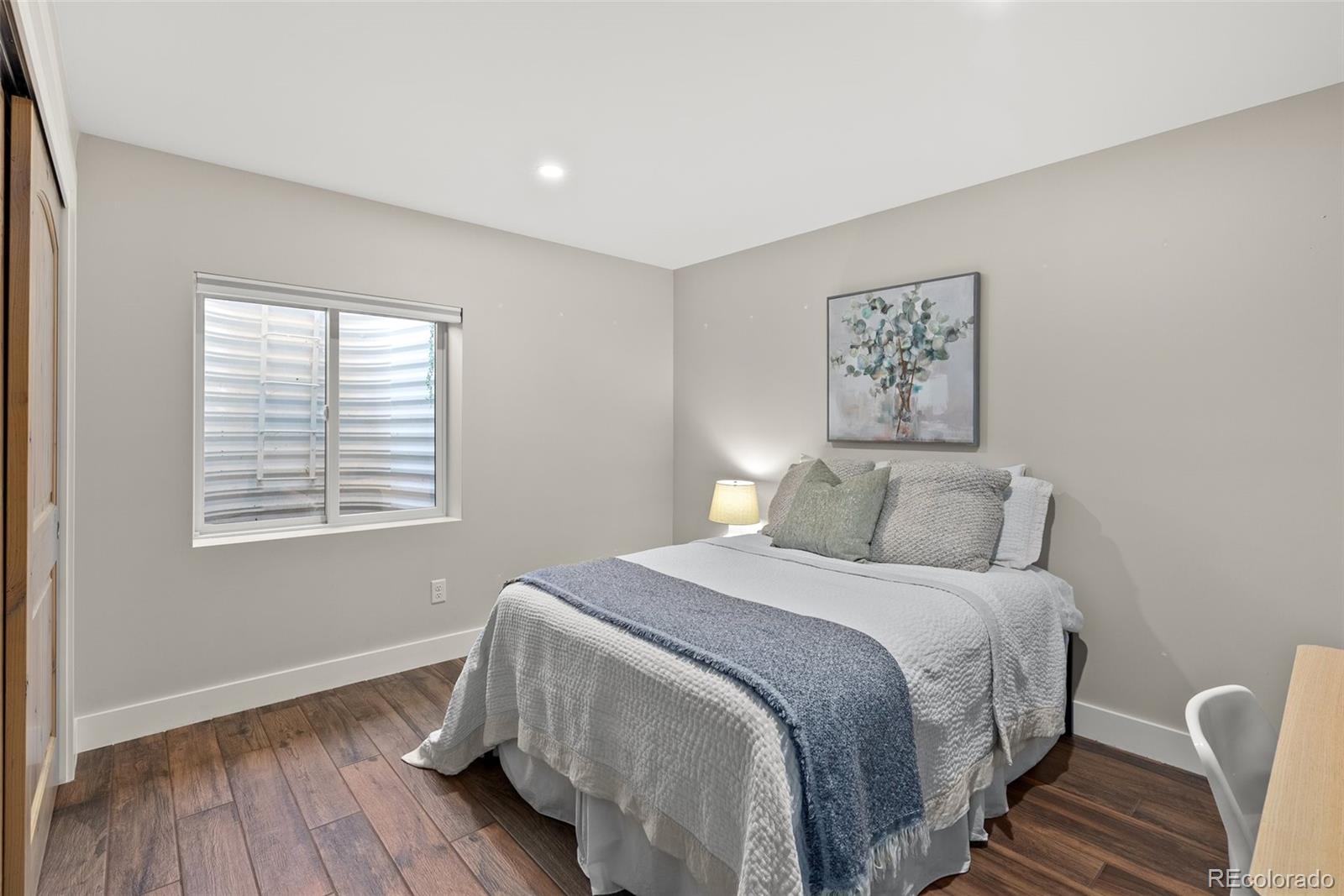9218 South Turkey Creek Road Morrison, CO 80465 - Photo 29 of 44 a bedroom with a bed and a window