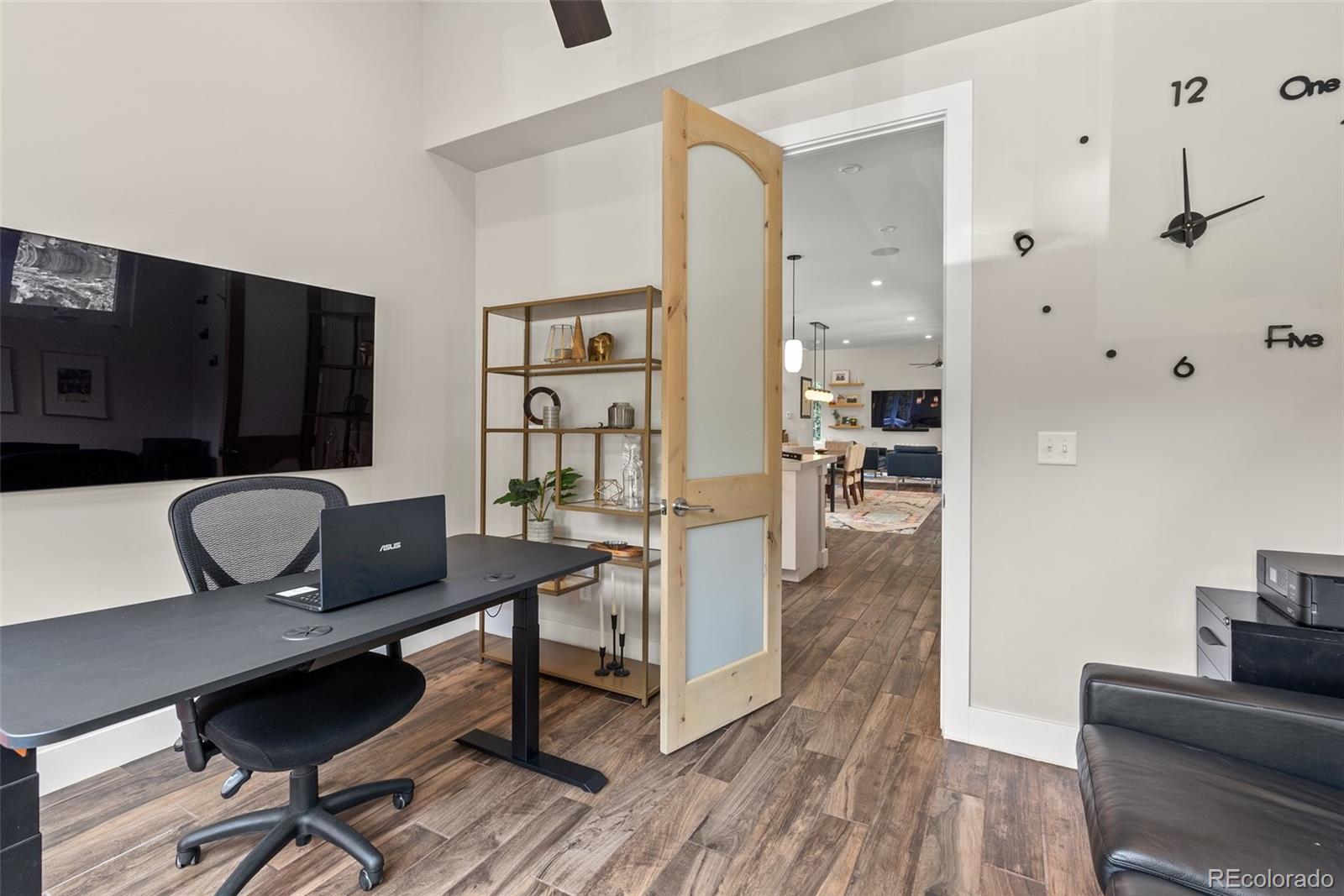 9218 South Turkey Creek Road Morrison, CO 80465 - Photo 30 of 44 a living room with furniture and a flat screen tv
