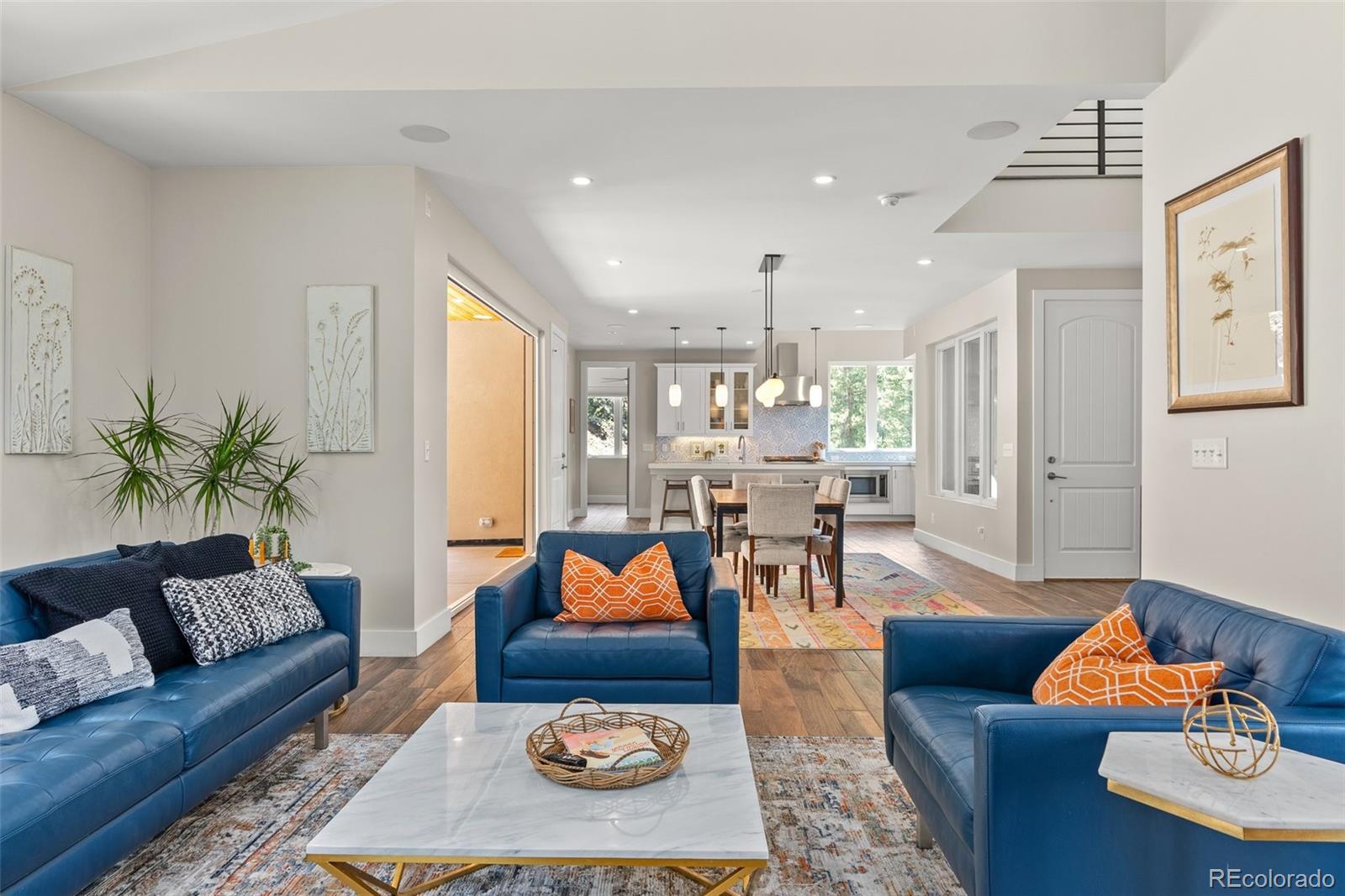 9218 South Turkey Creek Road Morrison, CO 80465 - Photo 4 of 44 a living room with furniture kitchen and a table