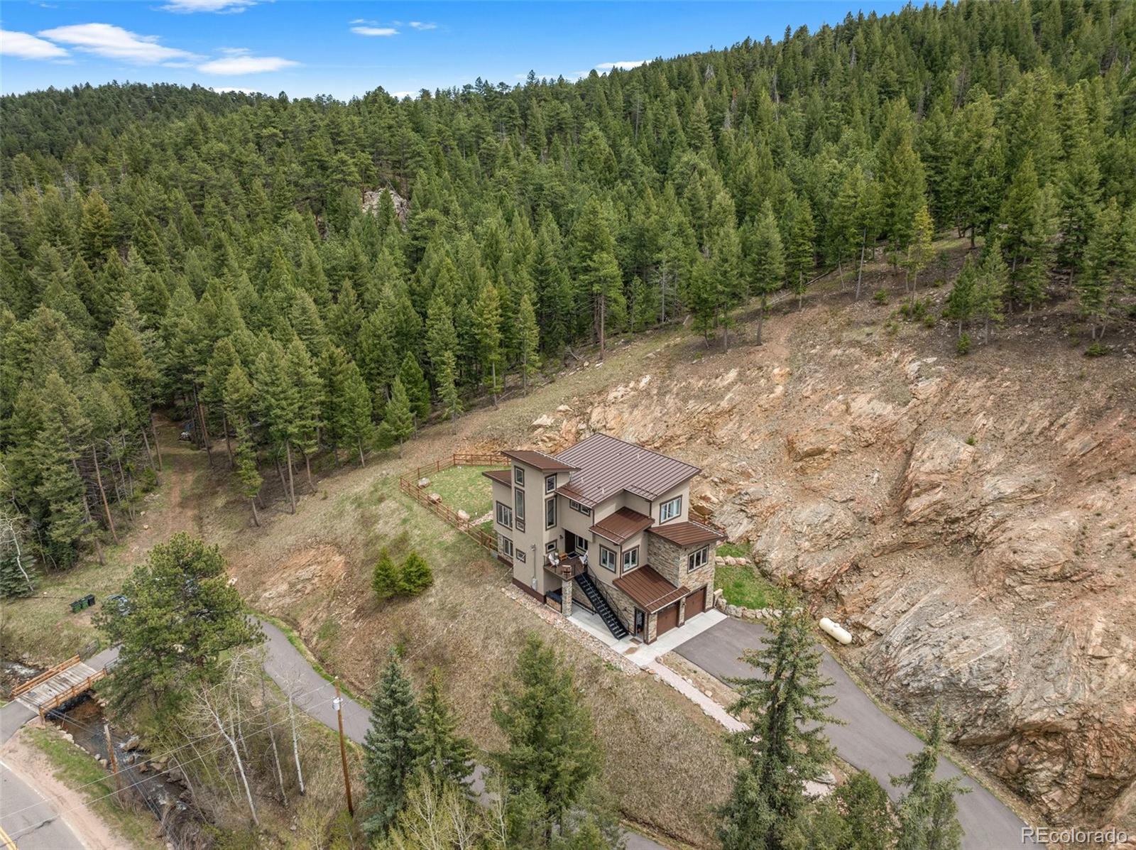 9218 South Turkey Creek Road Morrison, CO 80465 - Photo 44 of 44 a view of a tree with a yard