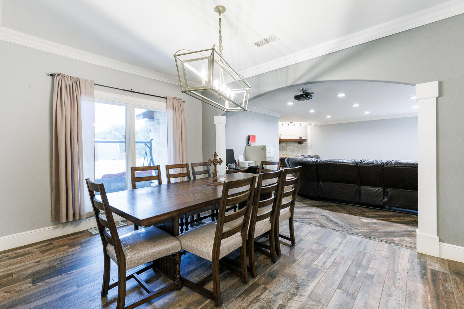 6523 East C R 6200 Lubbock, TX 79403 - Photo 23 of 86 a view of a dining room with furniture and wooden floor