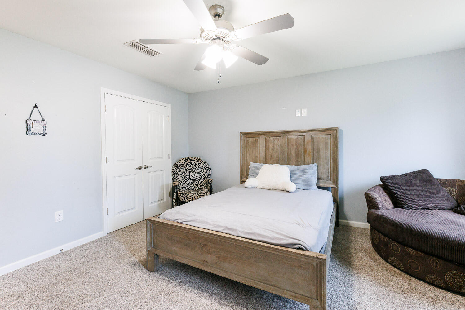 6523 East C R 6200 Lubbock, TX 79403 - Photo 52 of 86 a bedroom with a bed couch and window