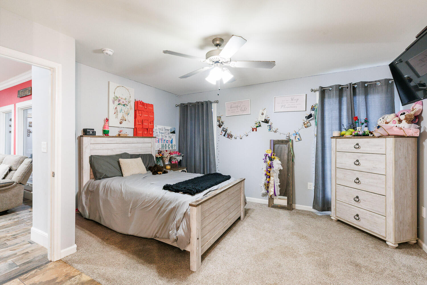 6523 East C R 6200 Lubbock, TX 79403 - Photo 61 of 86 a bedroom with a bed and a ceiling fan