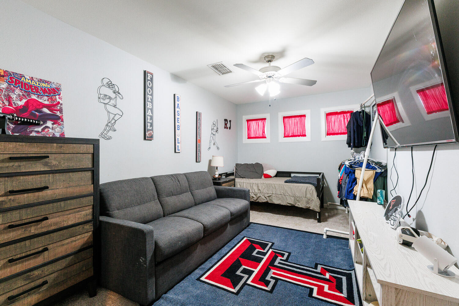 6523 East C R 6200 Lubbock, TX 79403 - Photo 64 of 86 a living room with furniture and a flat screen tv