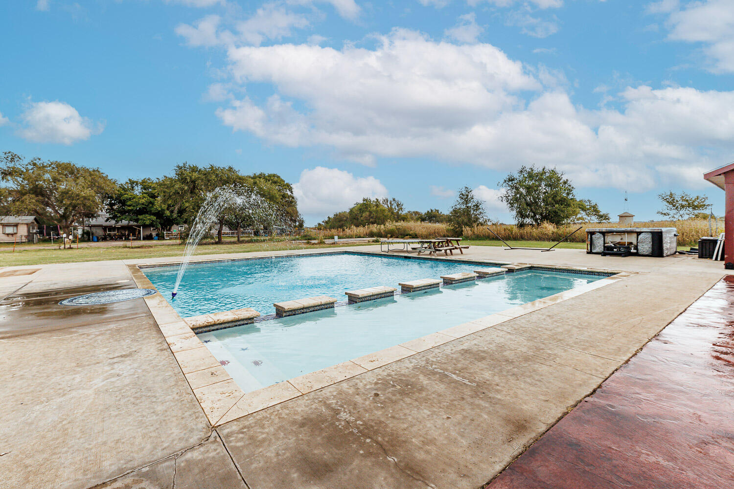 6523 East C R 6200 Lubbock, TX 79403 - Photo 74 of 86 a view of swimming pool with outdoor seating and barbeque oven