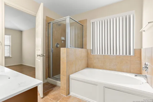 a bathroom with a sink and a bathtub