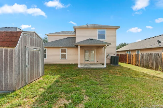 a view of a tiny house with a yard