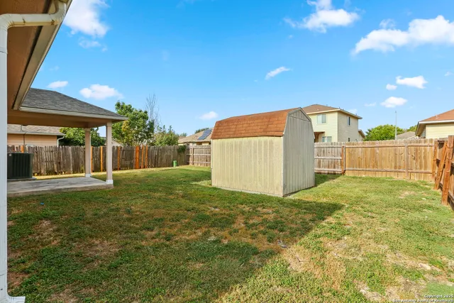 a view of a backyard of the house