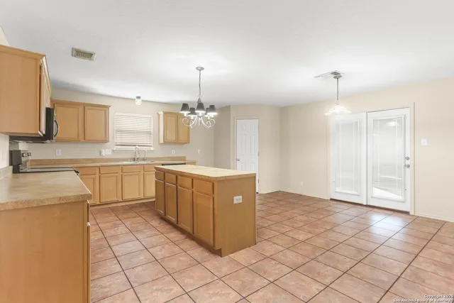a kitchen with a cabinets and counter space