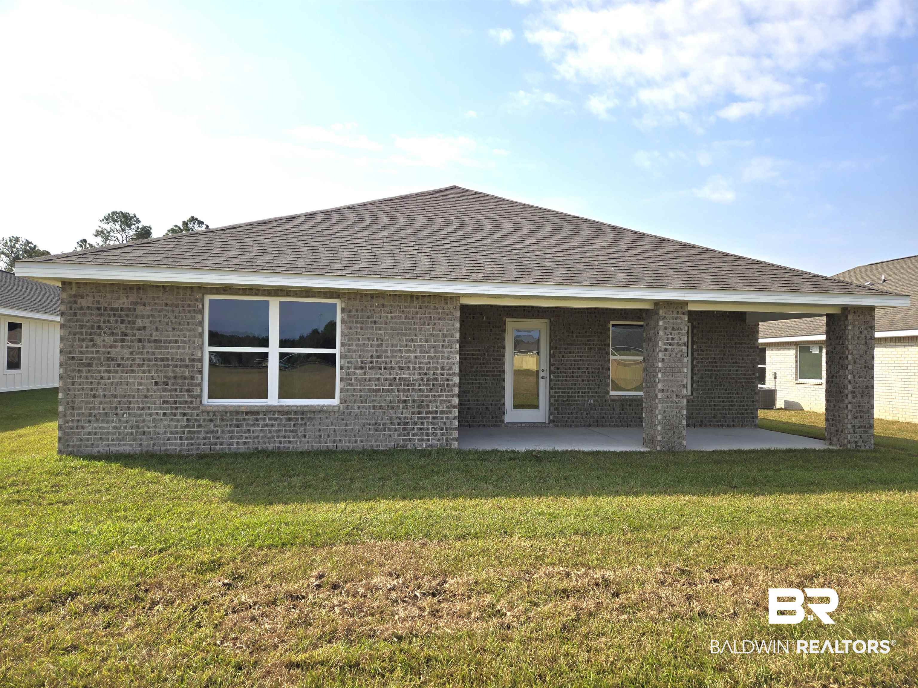 14717 Dayton Circle Foley, AL 36535 - Photo 2 of 39 Back of property with a patio area and a lawn