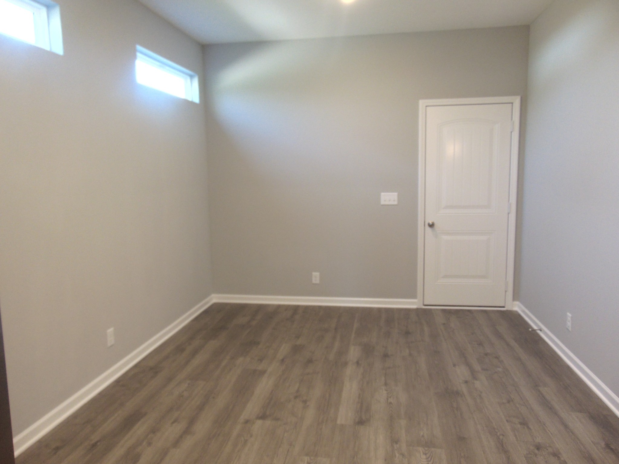 279 Spring Street La Vergne, TN 37086 - Photo 13 of 31 a view of an empty room with wooden floor and a window