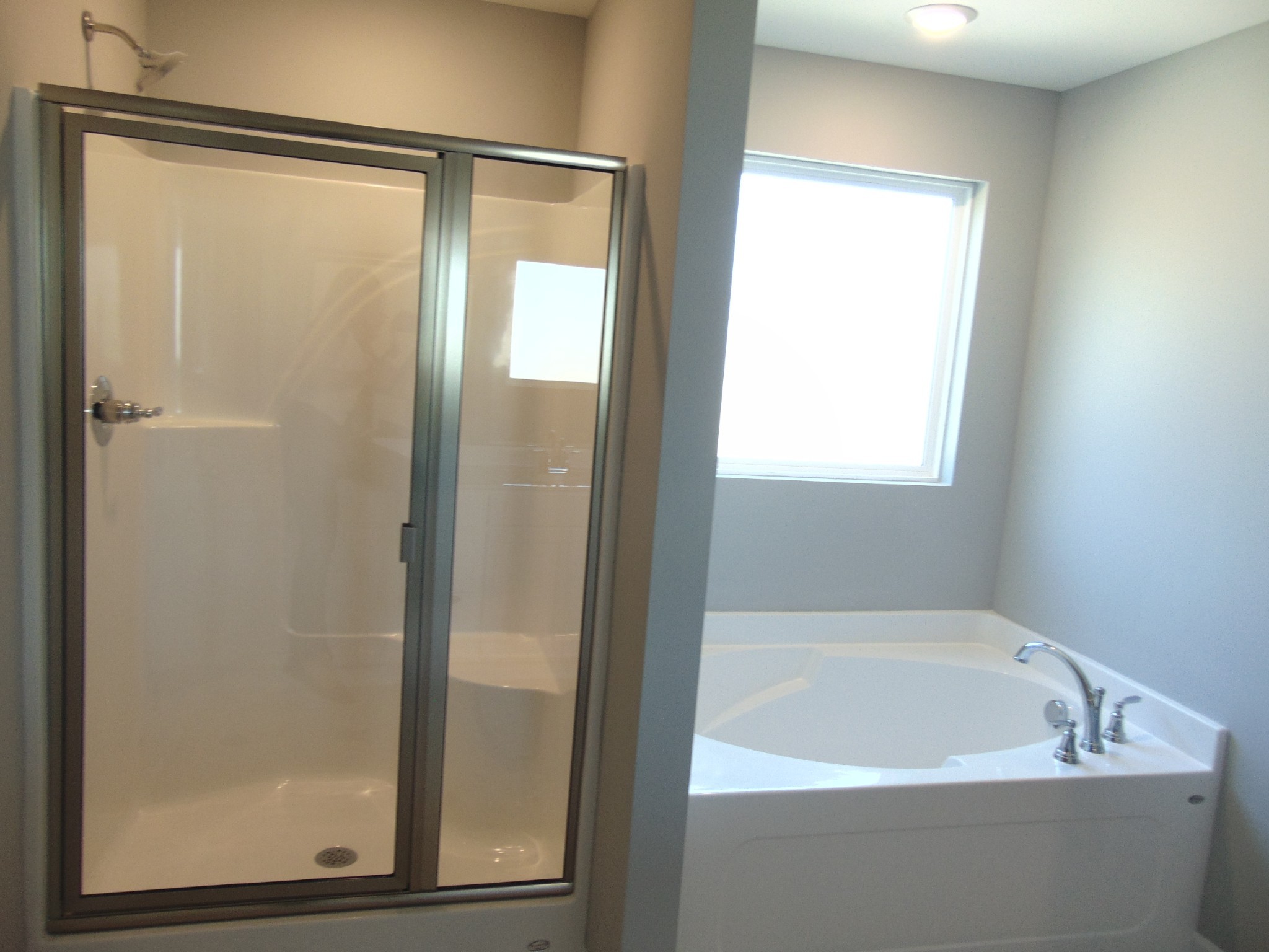 279 Spring Street La Vergne, TN 37086 - Photo 16 of 31 a bathroom with a bathtub and a shower