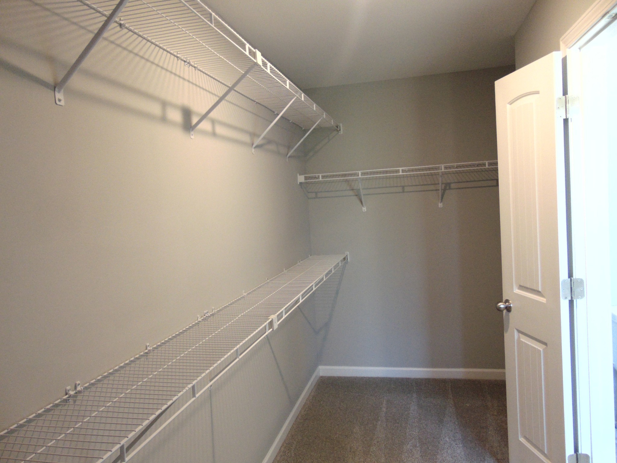 279 Spring Street La Vergne, TN 37086 - Photo 19 of 31 a view of a room with racks on the wall