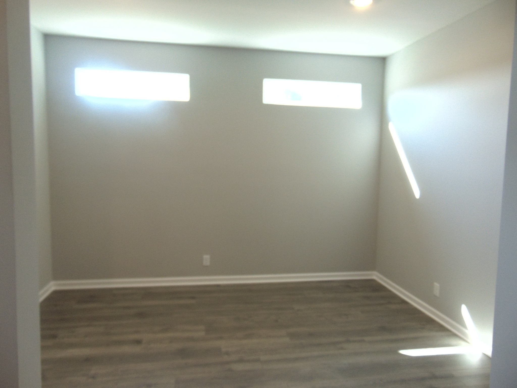279 Spring Street La Vergne, TN 37086 - Photo 3 of 31 a view of an empty room with wooden floor and a window
