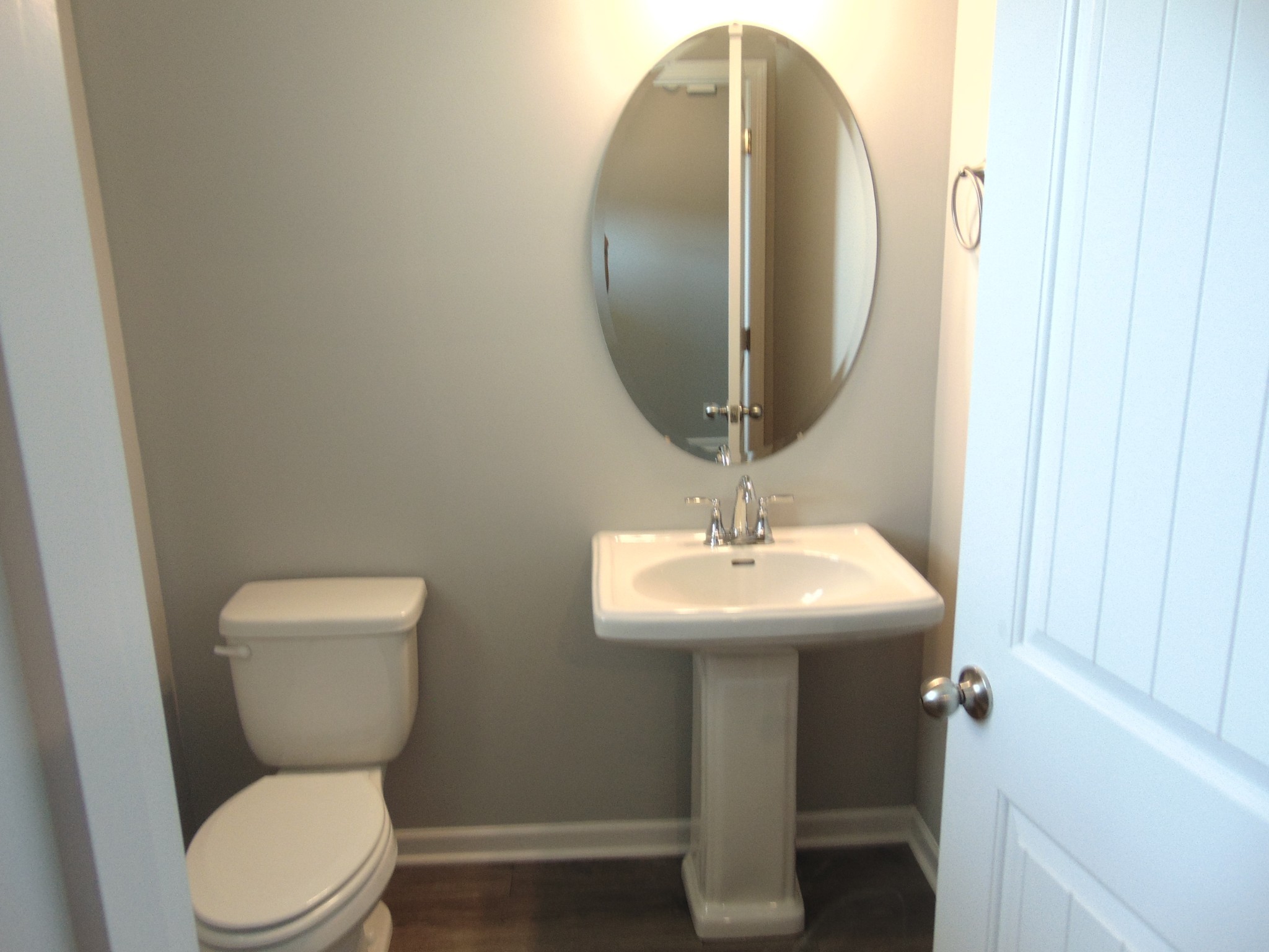 279 Spring Street La Vergne, TN 37086 - Photo 4 of 31 a bathroom with a toilet a sink and mirror