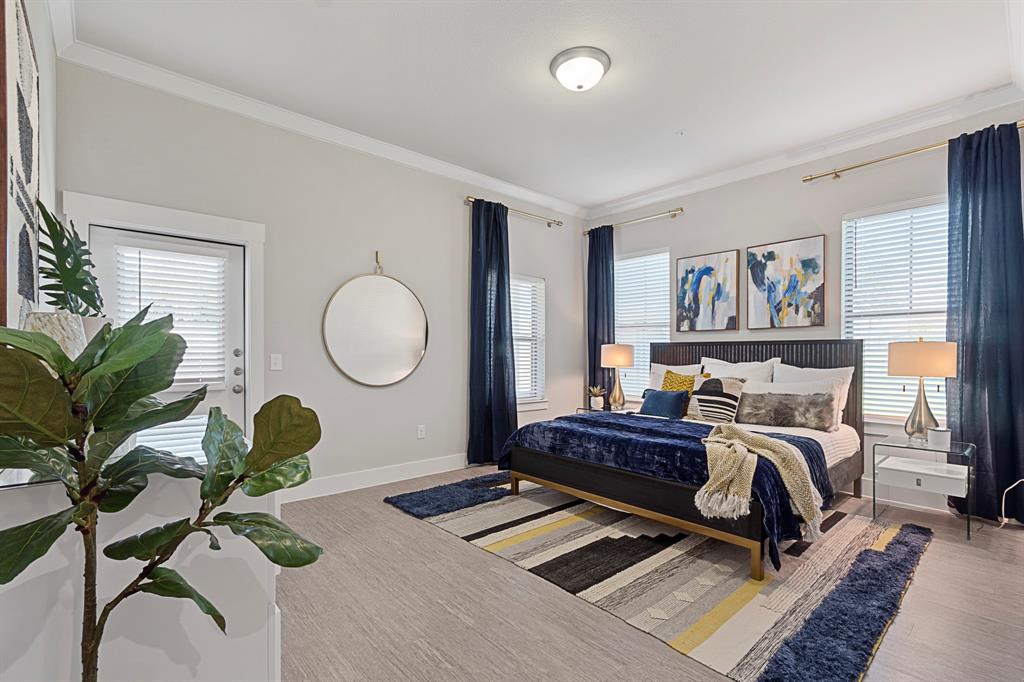 a living room with furniture gym equipment and a potted plant