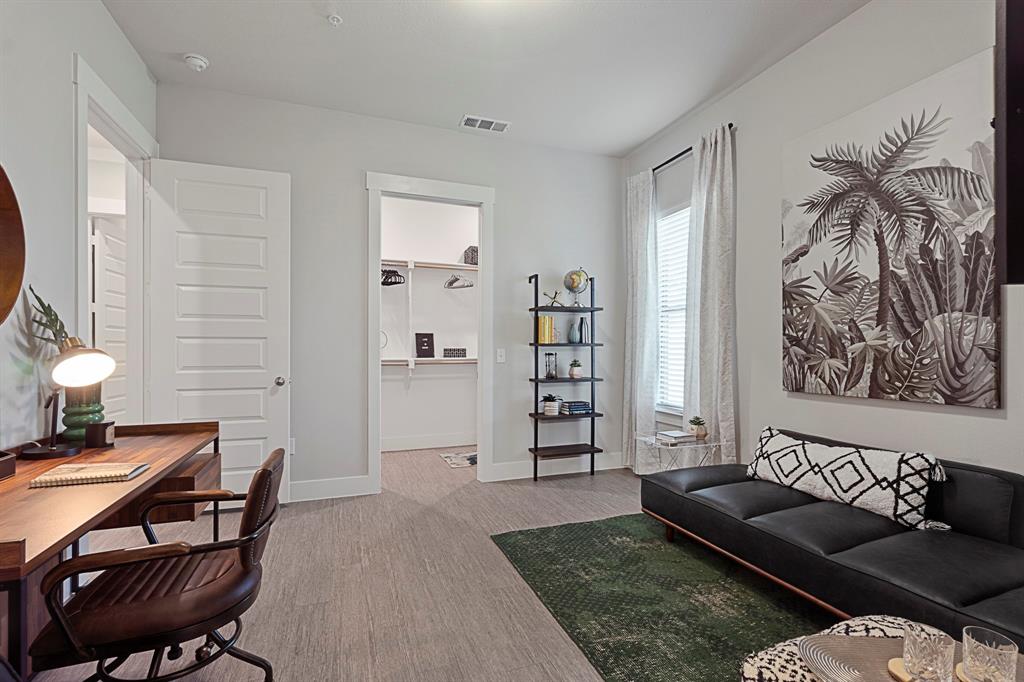 579 Lloyd's Road, Unit 821A Little Elm, TX 75068 - Photo 14 of 25 a living room with furniture and a rug