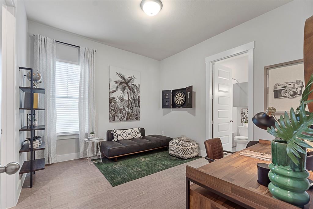 579 Lloyd's Road, Unit 821A Little Elm, TX 75068 - Photo 15 of 25 a living room with furniture and a potted plant