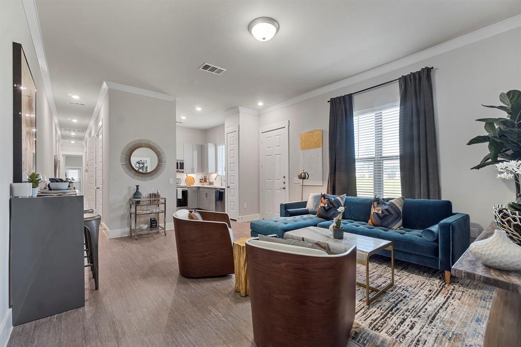 579 Lloyd's Road, Unit 821A Little Elm, TX 75068 - Photo 2 of 25 a living room with furniture and a large window