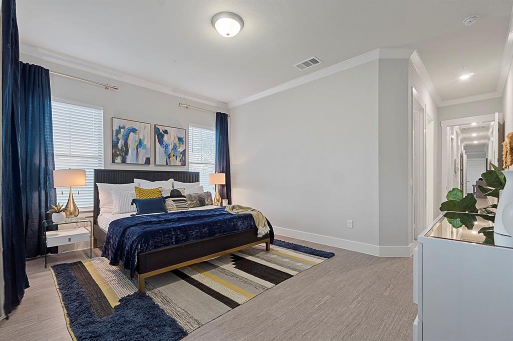 579 Lloyd's Road, Unit 821A Little Elm, TX 75068 - Photo 22 of 25 a bedroom with a bed and book shelf