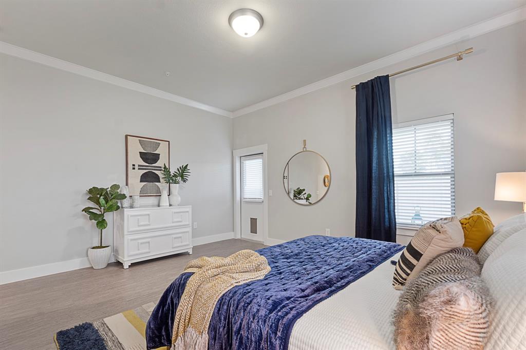 579 Lloyd's Road, Unit 821A Little Elm, TX 75068 - Photo 23 of 25 a bedroom with a bed and a window