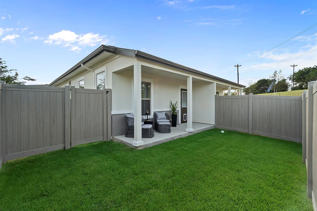 579 Lloyd's Road, Unit 821A Little Elm, TX 75068 - Photo 25 of 25 a view of a house with backyard and porch