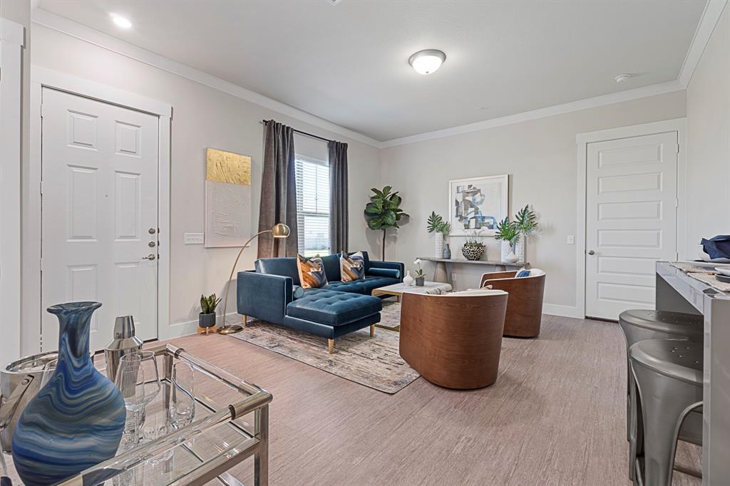 579 Lloyd's Road, Unit 821A Little Elm, TX 75068 - Photo 4 of 25 a living room with furniture and a potted plant