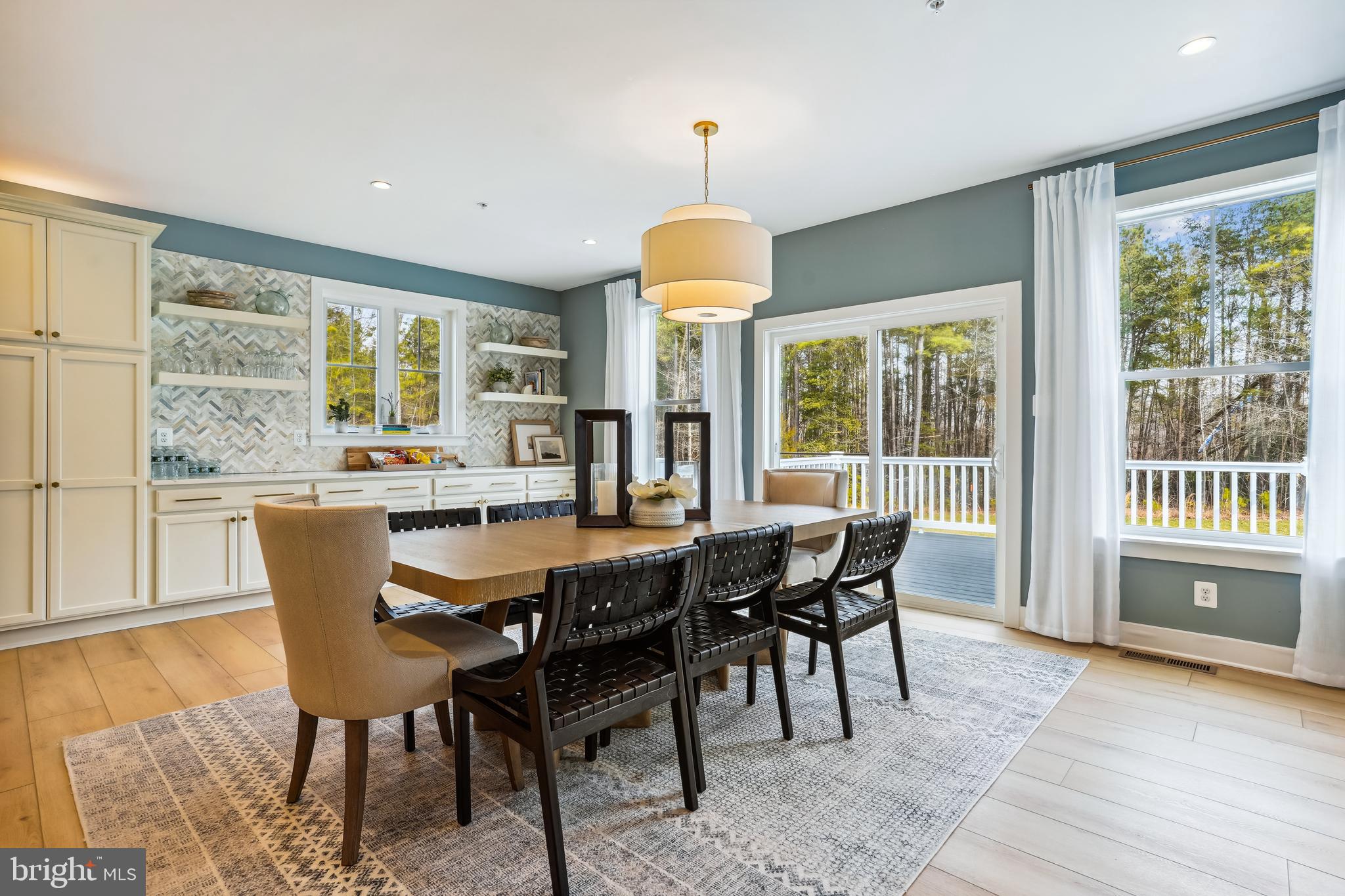 4996 Ilchester Road Ellicott City, MD 21043 - Photo 58 of 74 a dining room with furniture window wooden floor