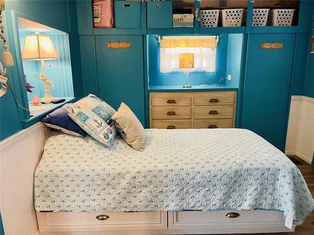 a bathroom with a sink a toilet a mirror and vanity