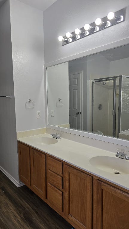 7704 Earp Way Austin, TX 78729 - Photo 11 of 20 a bathroom with a sink and a mirror