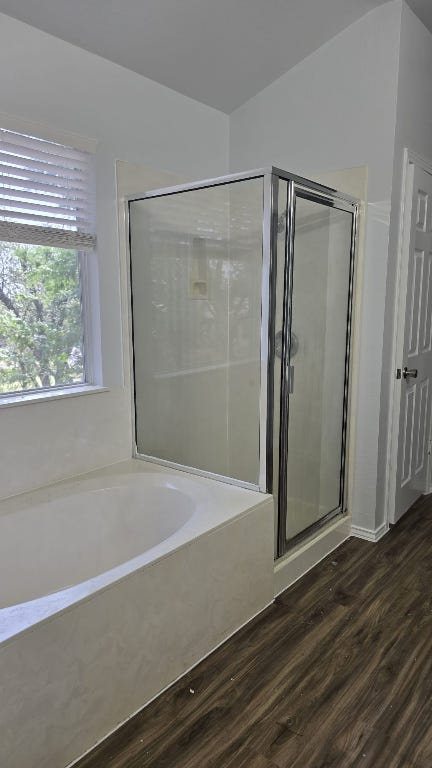 7704 Earp Way Austin, TX 78729 - Photo 12 of 20 a bathroom with a bathtub and a shower