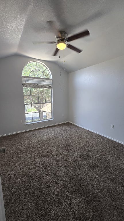 7704 Earp Way Austin, TX 78729 - Photo 13 of 20 an empty room with windows and a ceiling fan