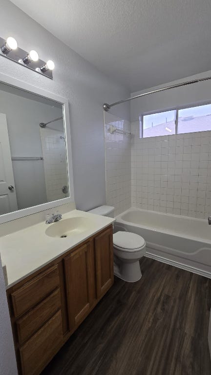 7704 Earp Way Austin, TX 78729 - Photo 14 of 20 a bathroom with a toilet a sink and mirror
