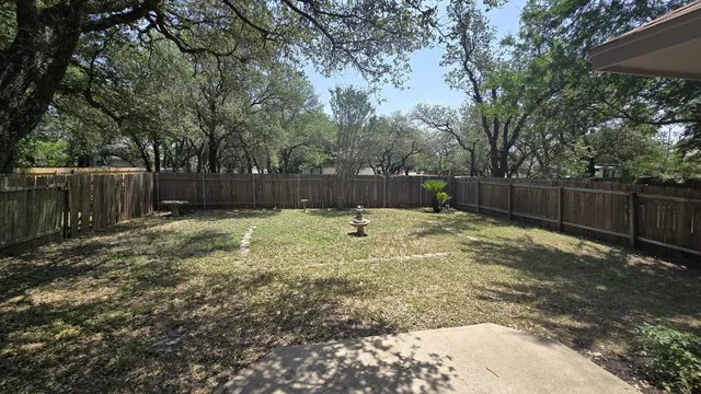 a swimming pool with wooden fence