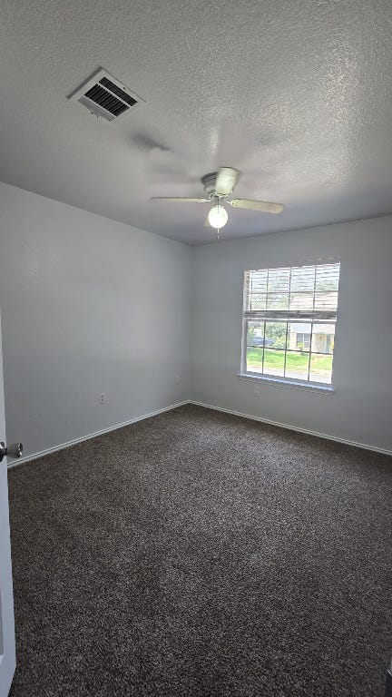 7704 Earp Way Austin, TX 78729 - Photo 7 of 20 an empty room with windows and fan