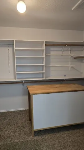 a view of storage and utility room with washer and dryer