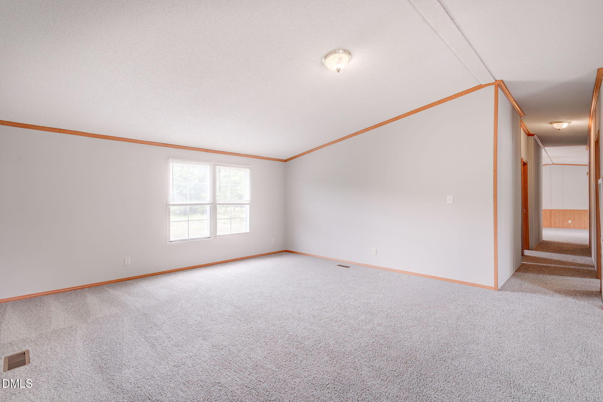 10037 Smith Road Middlesex, NC 27557 - Photo 20 of 36 an empty room with windows and entrance