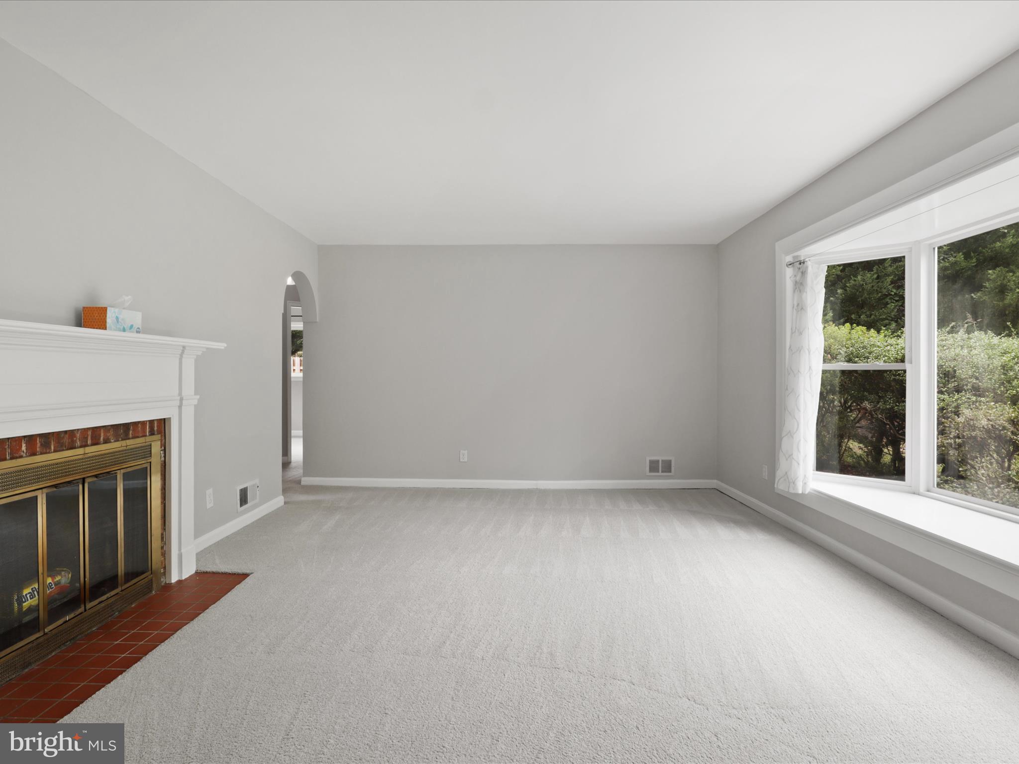 7533 Hollindale Court Alexandria, VA 22306 - Photo 19 of 78 an empty room with windows and fireplace